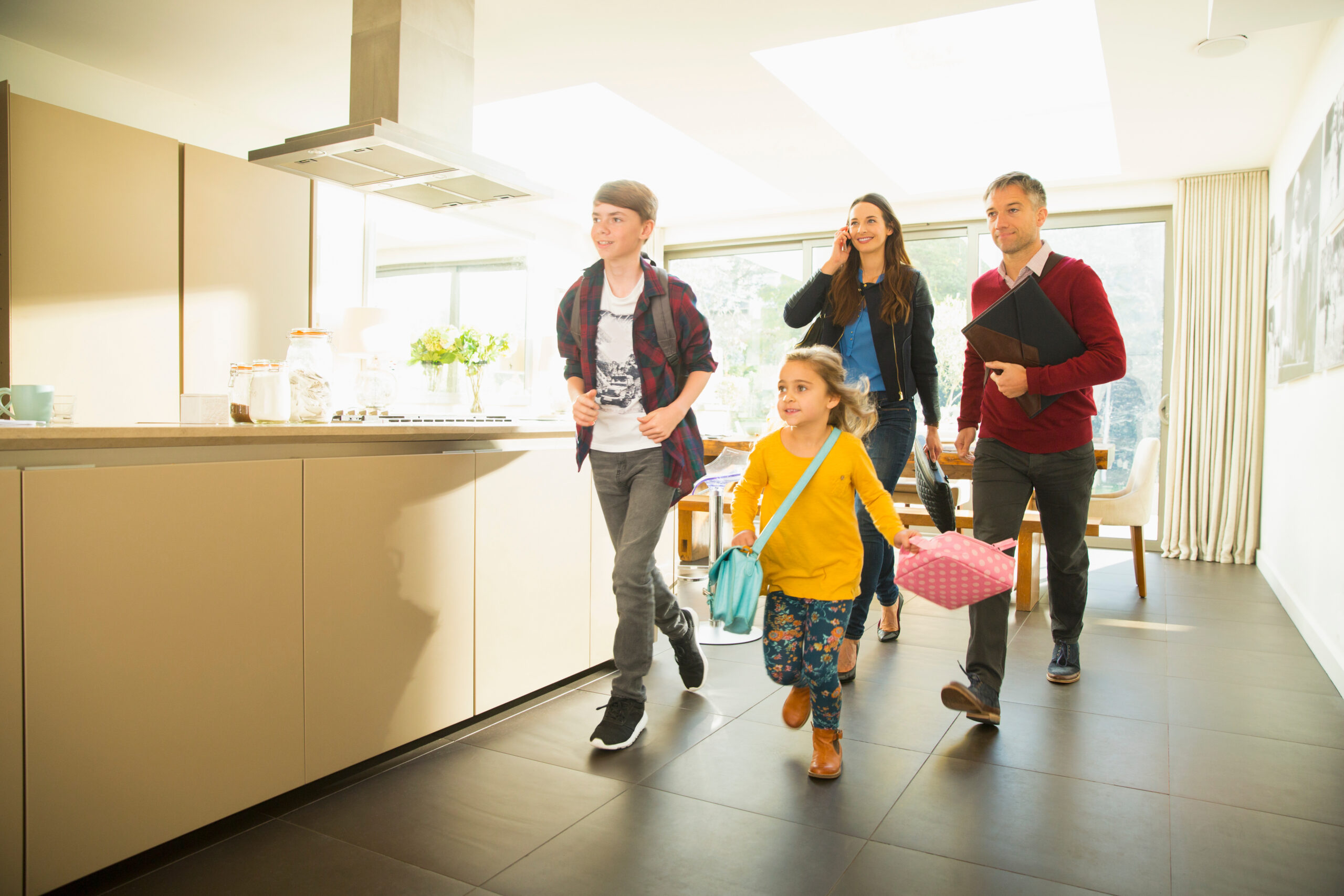 Family rushing out of the house in the morning